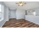 A spacious living area with hardwood floors and neutral walls at 7115 N Lyndhurst Xing, McCordsville, IN 46055