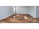 Neutral room with a bright window, laminate flooring, and a grey door at 7115 N Lyndhurst Xing, McCordsville, IN 46055