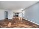 Open layout reveals a modern kitchen from this cozy living area with laminate floors at 7115 N Lyndhurst Xing, McCordsville, IN 46055