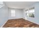 Inviting living room with lots of light, laminate floors, and neutral walls at 7115 N Lyndhurst Xing, McCordsville, IN 46055