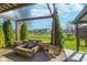 Outdoor patio with stone fire pit, and backyard views at 7115 N Lyndhurst Xing, McCordsville, IN 46055