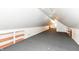 Spacious attic with built-in shelving offers ample storage and potential for customized use at 7145 Lafayette Rd, Indianapolis, IN 46278