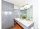 Bathroom with double sinks, granite countertops, and updated cabinets providing ample storage at 7145 Lafayette Rd, Indianapolis, IN 46278