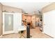 An open kitchen area features a glass sliding door and bright work area at 7145 Lafayette Rd, Indianapolis, IN 46278