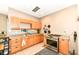 A well-lit kitchen showcases wooden cabinets and tile floors at 7145 Lafayette Rd, Indianapolis, IN 46278