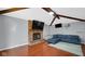 Spacious living room featuring a brick fireplace, mounted flat screen TV and a comfortable sectional sofa at 715 Pioneer Dr, Indianapolis, IN 46217