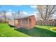 Backyard outbuilding with a covered porch and slide, offering ample space for outdoor activities at 715 Pioneer Dr, Indianapolis, IN 46217