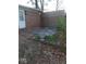 Back exterior featuring a fenced-in area, back door, and brick facade at 721 1St Ne Ave, Carmel, IN 46032