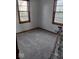 Bedroom view with recently cleaned carpet and two windows at 721 1St Ne Ave, Carmel, IN 46032