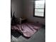 Bedroom with a window and personal items on the floor at 721 1St Ne Ave, Carmel, IN 46032