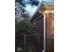 Exterior side view of a brick home, showcasing the brickwork and gutter system at 721 1St Ne Ave, Carmel, IN 46032