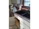 Close-up of kitchen sink and countertop area, featuring a black double sink at 721 1St Ne Ave, Carmel, IN 46032
