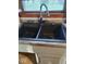 Close-up of black kitchen sink with stainless steel faucet and view of window at 721 1St Ne Ave, Carmel, IN 46032