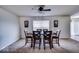 Well-lit dining room with a wooden table and six chairs, perfect for Gathering gatherings at 729 Stonehenge Way, Brownsburg, IN 46112