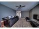 Relaxing second living room offering lots of space, cozy decor and ceiling fan at 729 Stonehenge Way, Brownsburg, IN 46112