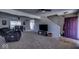 Inviting living room with plush seating, adjacent dining area, and staircase, creating a versatile living space at 729 Stonehenge Way, Brownsburg, IN 46112
