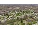 Expansive aerial view of a residential neighborhood with mature trees and well-maintained lawns at 7326 Elm Ridge Dr, Indianapolis, IN 46236