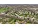 An elevated view of a quiet community featuring tree-lined streets and diverse architectural designs at 7326 Elm Ridge Dr, Indianapolis, IN 46236