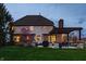 Exterior backyard view featuring a patio with pergola, lush lawn, and mature trees at 7326 Elm Ridge Dr, Indianapolis, IN 46236