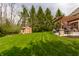A landscaped backyard with a shed and patio for outdoor enjoyment and storage at 7326 Elm Ridge Dr, Indianapolis, IN 46236