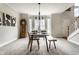 Dining room with natural light, wood table, and view of the backyard at 7326 Elm Ridge Dr, Indianapolis, IN 46236