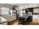 Bright kitchen featuring a large island, granite countertops, and stainless steel appliances at 7326 Elm Ridge Dr, Indianapolis, IN 46236
