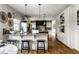 Spacious kitchen featuring granite countertops, hardwood floors, and white cabinets at 7326 Elm Ridge Dr, Indianapolis, IN 46236