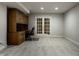 Office with wooden desk, cabinets, and French doors for a professional work-from-home space at 7326 Elm Ridge Dr, Indianapolis, IN 46236