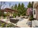 Outdoor patio with a pergola, dining table, and lounge furniture, perfect for relaxing or entertaining at 7326 Elm Ridge Dr, Indianapolis, IN 46236