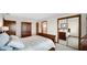 Cozy bedroom featuring a sleigh bed, wardrobe, and access to an en-suite bathroom through a doorway at 803 S School St, Brownsburg, IN 46112