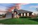 Charming brick home with well-maintained lawn and a two-car garage at 803 S School St, Brownsburg, IN 46112