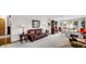 Cozy living room with plush brown leather seating, neutral walls and carpet, and traditional wood furniture at 803 S School St, Brownsburg, IN 46112