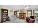 Cozy living room boasts a brick fireplace, built-in bookshelves, and comfortable seating at 803 S School St, Brownsburg, IN 46112