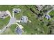 An aerial view of a well-manicured property featuring a patio with outdoor seating and mature trees at 978 S Fairway Village Ct, Greenfield, IN 46140