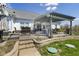 Outdoor patio with pergola, stone steps, and landscaped garden at 978 S Fairway Village Ct, Greenfield, IN 46140