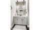 Stylish bathroom featuring modern fixtures, decorative mirror, and wall art at 978 S Fairway Village Ct, Greenfield, IN 46140