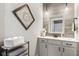 Stylish bathroom featuring modern fixtures, decorative mirror, and wall art at 978 S Fairway Village Ct, Greenfield, IN 46140