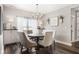 Bright dining room with shiplap accent wall, chandelier, and ample natural light at 978 S Fairway Village Ct, Greenfield, IN 46140
