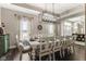 Elegant dining room with a tray ceiling, chandelier, table and chairs at 978 S Fairway Village Ct, Greenfield, IN 46140