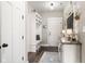 Welcoming entryway with a built-in storage bench, wood floors, and modern decor at 978 S Fairway Village Ct, Greenfield, IN 46140