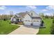 Well maintained home with ample parking space, lush green lawn and beautiful landscape at 978 S Fairway Village Ct, Greenfield, IN 46140