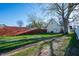 Backyard featuring a large tree, a grass area, and a wooden fence at 106 N Linwood Ave, Indianapolis, IN 46201