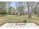 This serene backyard features a storage shed and lush landscaping, creating a peaceful outdoor retreat at 1132 Sheffield Dr, Avon, IN 46123