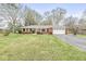 Charming brick ranch-style home with a well-maintained lawn and attached two car garage at 1132 Sheffield Dr, Avon, IN 46123