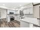 Modern kitchen featuring white cabinets, stainless steel appliances, and quartz countertops at 1132 Sheffield Dr, Avon, IN 46123