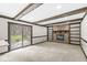 Cozy living room featuring a stone fireplace, built-in bookshelves, and a sliding door to the outdoors at 1132 Sheffield Dr, Avon, IN 46123