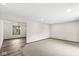 Bright living room with hardwood floors leading to a carpeted area and a bright window at 1132 Sheffield Dr, Avon, IN 46123
