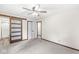 Main bedroom featuring sliding barn door to bathroom, ensuite bath, and neutral carpet at 1132 Sheffield Dr, Avon, IN 46123