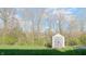 Backyard shed for storing lawn equipment or gardening supplies with mature trees at 1139 Topp Creek Dr, Indianapolis, IN 46214