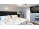Bedroom featuring large bed with tufted headboard, ceiling fan, dresser and television at 1139 Topp Creek Dr, Indianapolis, IN 46214